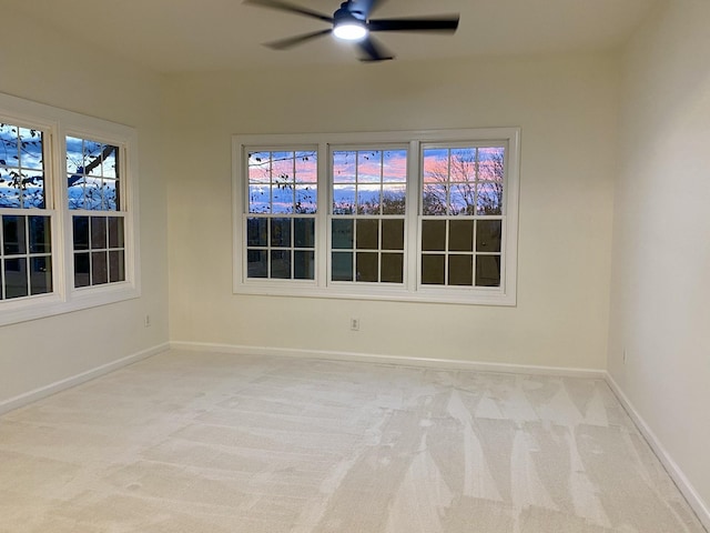 empty room with light carpet and ceiling fan