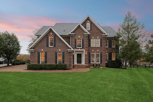 view of front of home featuring a yard