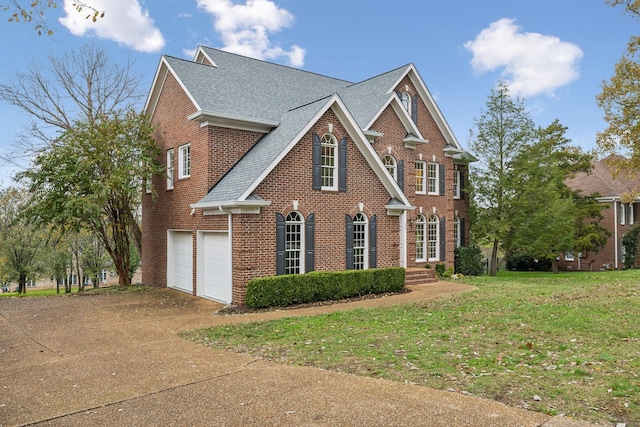 view of front facade with a garage and a front yard