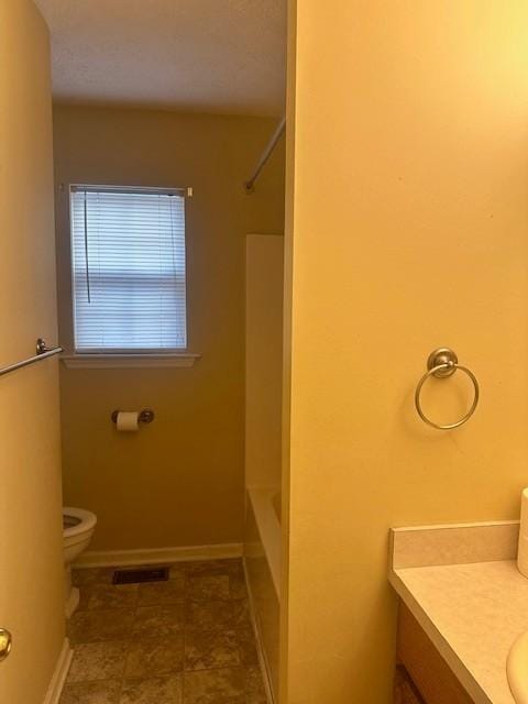 full bathroom with shower / bath combination, vanity, and toilet