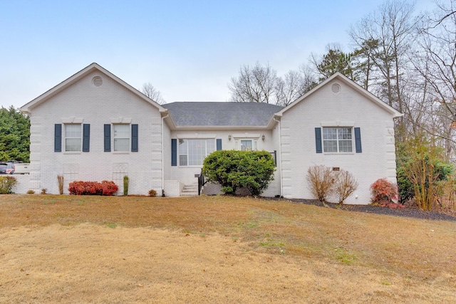 ranch-style house featuring a front lawn