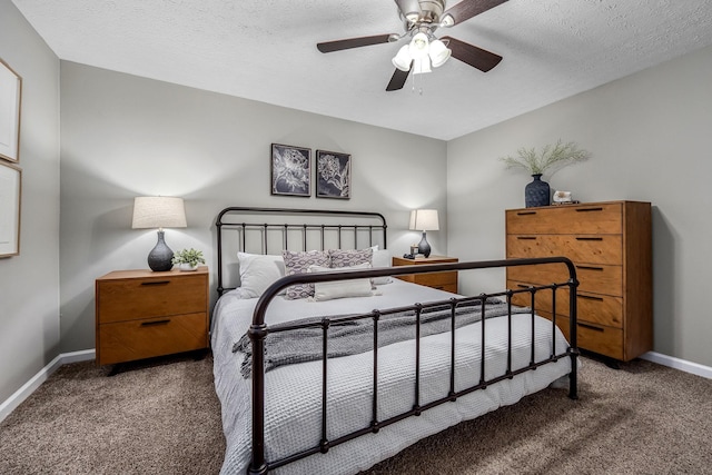 carpeted bedroom with ceiling fan and a textured ceiling