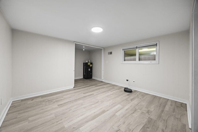 empty room with light hardwood / wood-style floors