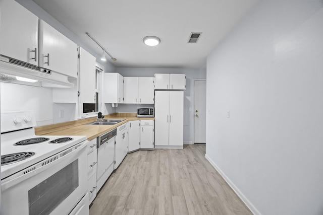 kitchen featuring sink, white cabinets, track lighting, white appliances, and light hardwood / wood-style flooring