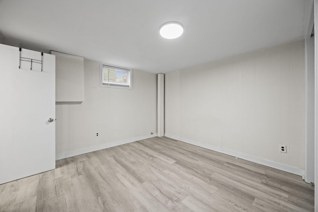 basement with light hardwood / wood-style floors