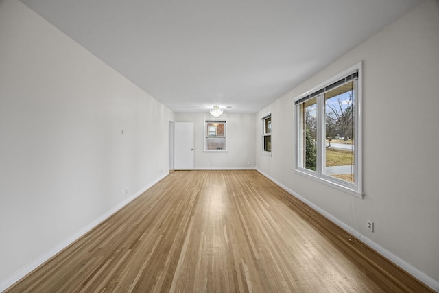 empty room with light hardwood / wood-style floors