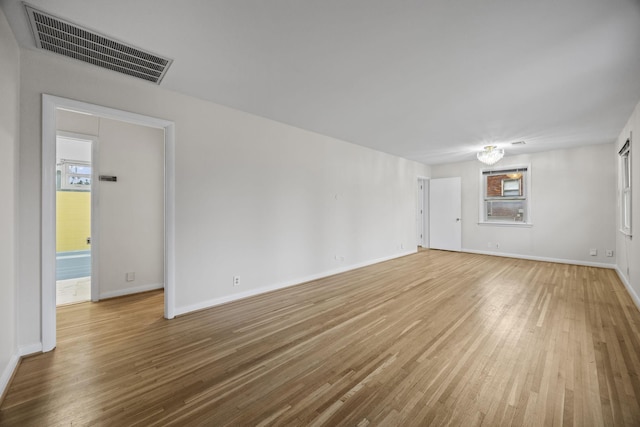 unfurnished living room featuring hardwood / wood-style flooring