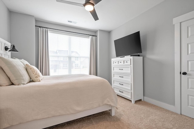 bedroom featuring light colored carpet and ceiling fan