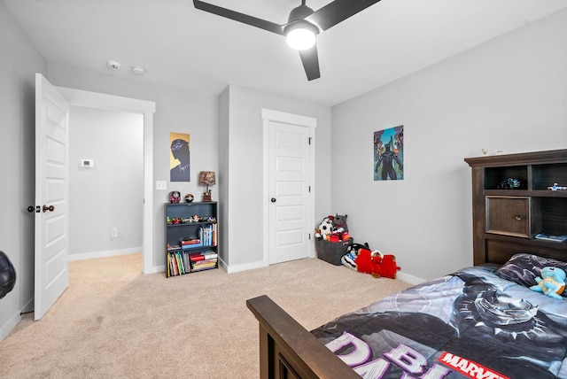 carpeted bedroom featuring ceiling fan