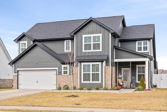 view of front of home featuring a garage and a front lawn