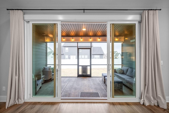 entryway featuring hardwood / wood-style floors and french doors