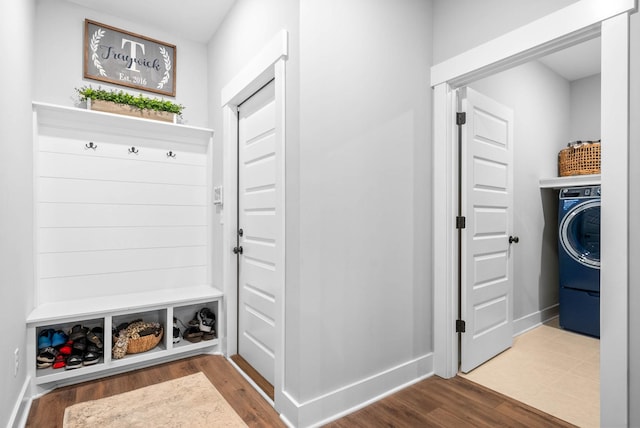 mudroom with wood-type flooring and washer / clothes dryer