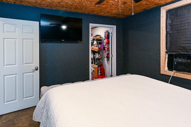 bedroom featuring cooling unit and ceiling fan