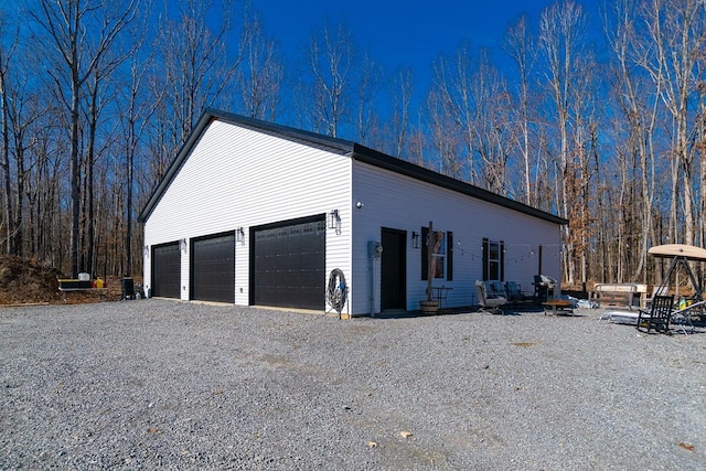 view of property exterior with a garage