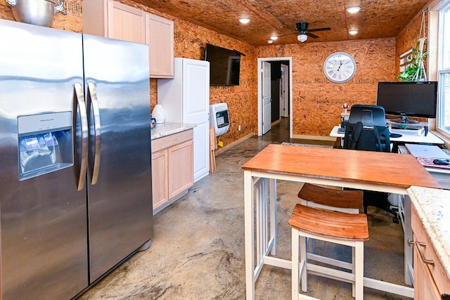 kitchen featuring heating unit, light brown cabinets, ceiling fan, and stainless steel refrigerator with ice dispenser