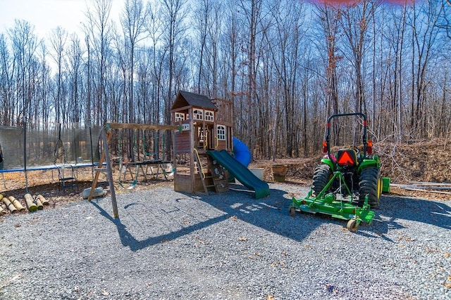 view of play area with a trampoline