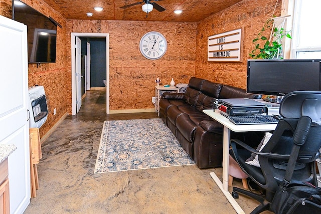 interior space featuring ceiling fan and heating unit