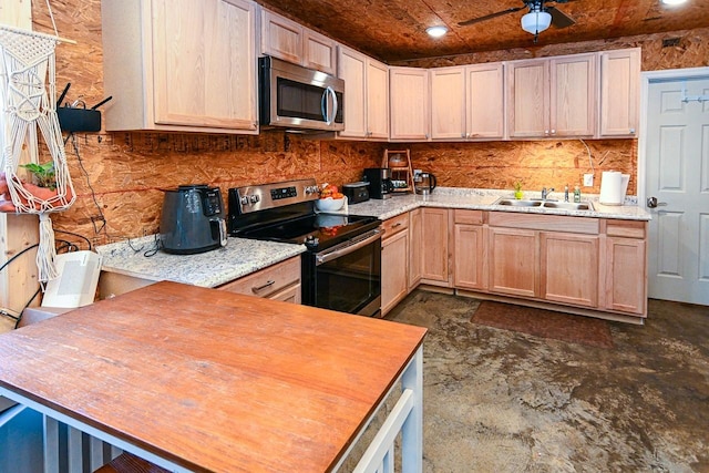 kitchen with sink, ceiling fan, backsplash, stainless steel appliances, and light brown cabinets