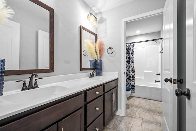 full bathroom featuring vanity, shower / bathtub combination with curtain, and toilet