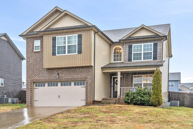 craftsman inspired home featuring a garage, a porch, cooling unit, and a front lawn