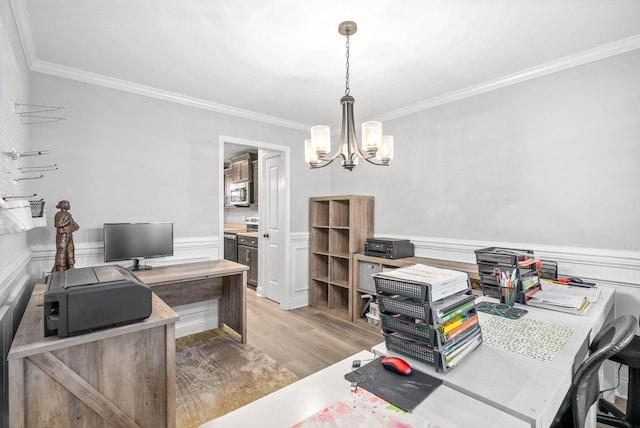 office area with crown molding, a chandelier, and light wood-type flooring