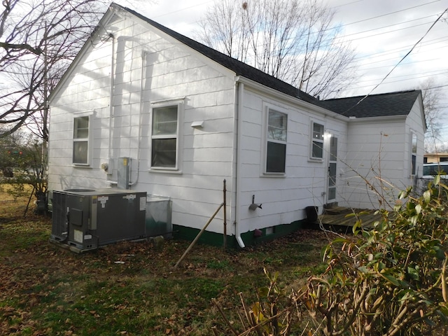 view of side of property with cooling unit