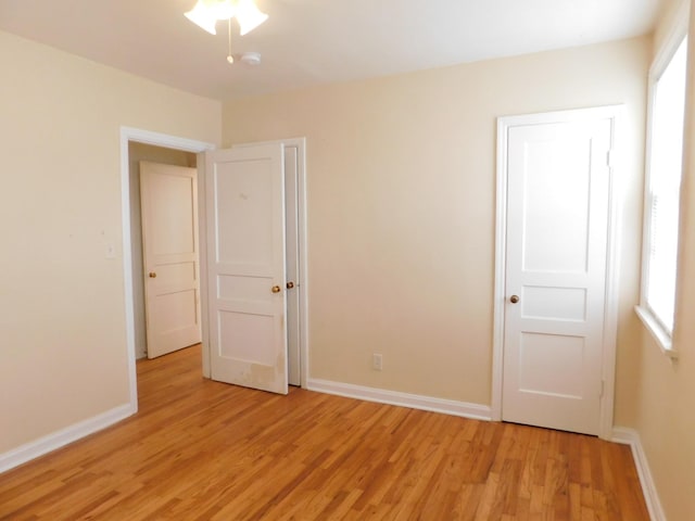 unfurnished bedroom featuring light wood-type flooring