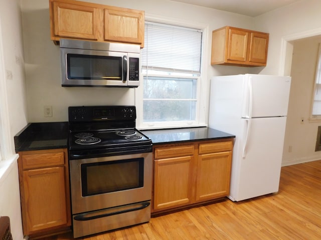 kitchen featuring appliances with stainless steel finishes and light wood-type flooring