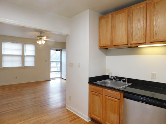 kitchen featuring sink, stainless steel dishwasher, ceiling fan, and light wood-type flooring