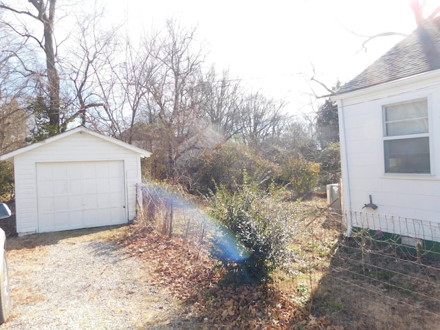 view of yard with a garage and an outdoor structure