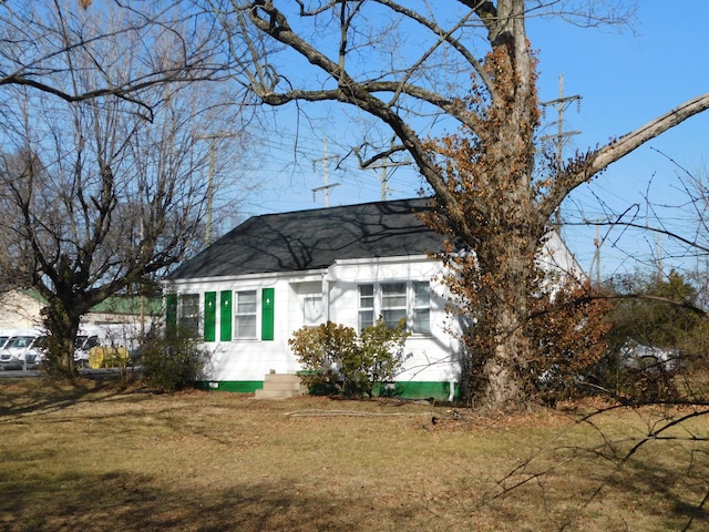 view of side of property with a yard