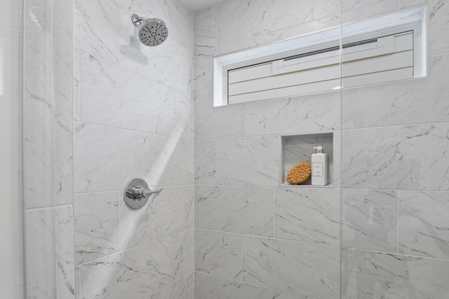 bathroom featuring tiled shower