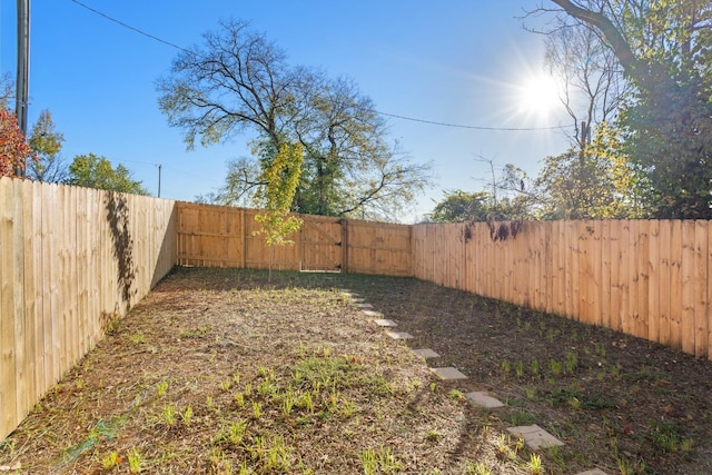 view of yard with a fenced backyard