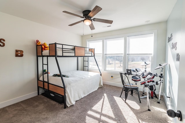 bedroom with ceiling fan and carpet