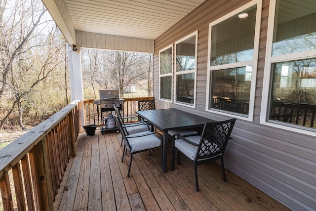 wooden deck featuring area for grilling