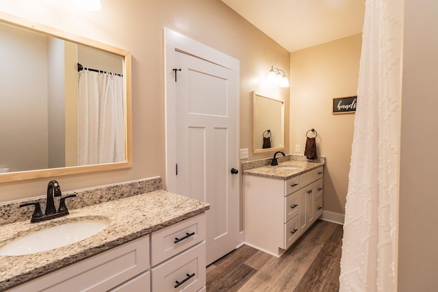 bathroom with vanity and hardwood / wood-style floors