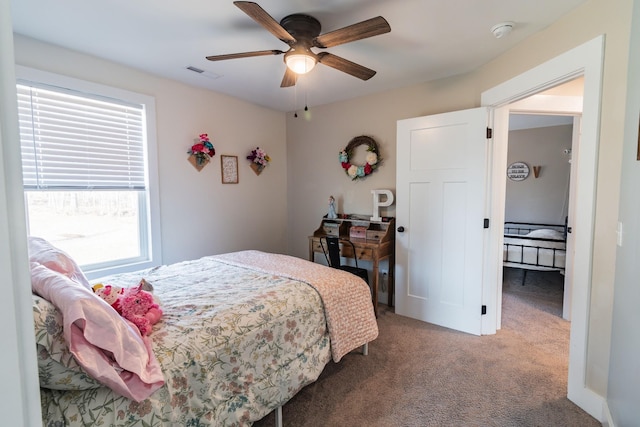 carpeted bedroom featuring ceiling fan