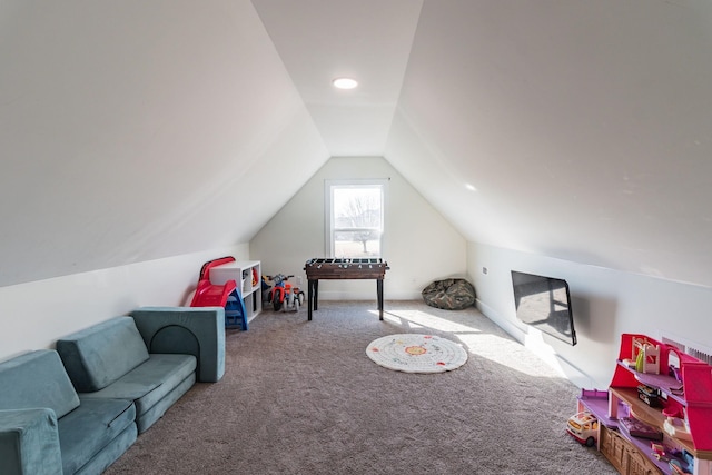 recreation room featuring vaulted ceiling and carpet floors