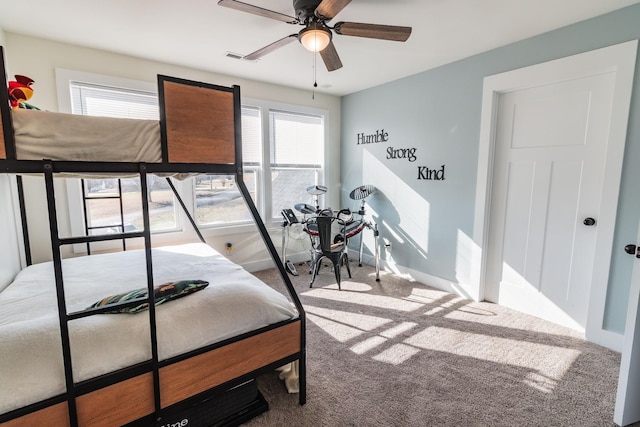 bedroom with multiple windows and carpet flooring