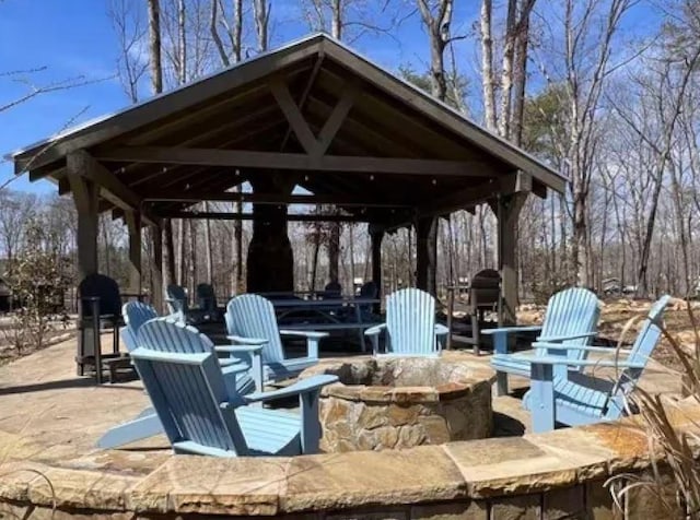 view of patio / terrace featuring a gazebo and an outdoor fire pit