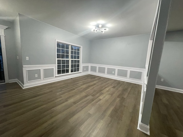 spare room featuring dark wood-type flooring