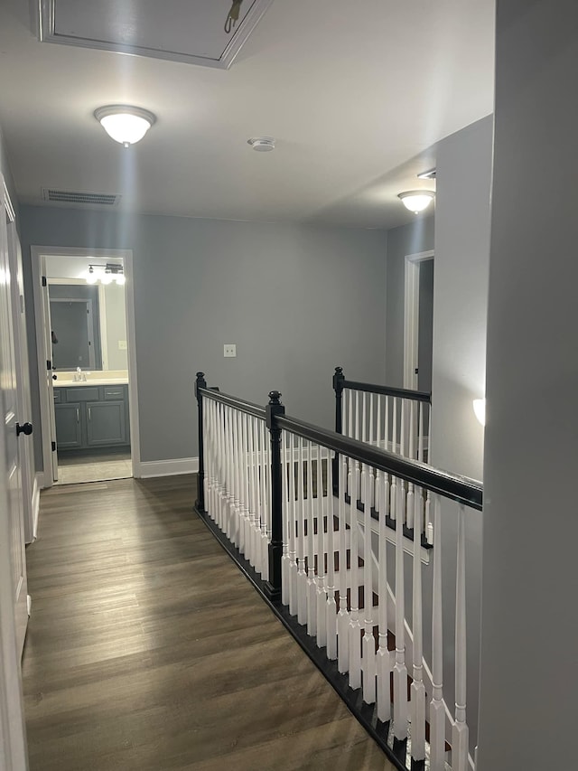 hall featuring sink and dark hardwood / wood-style flooring