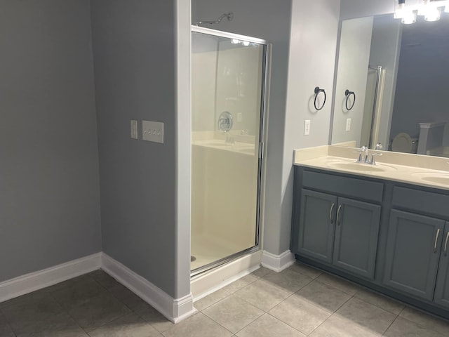 bathroom with vanity, an enclosed shower, and tile patterned flooring