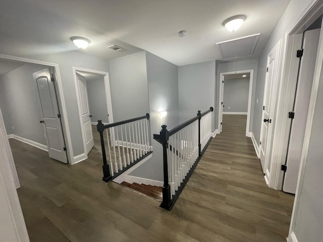 hall with dark hardwood / wood-style floors