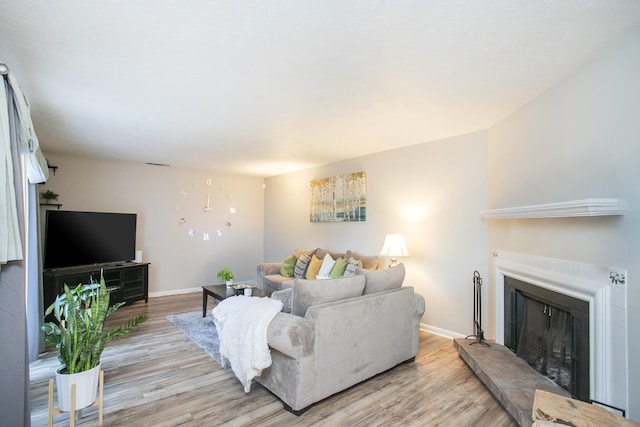 living room with light hardwood / wood-style flooring