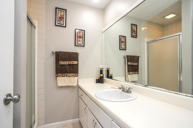 bathroom with an enclosed shower and vanity