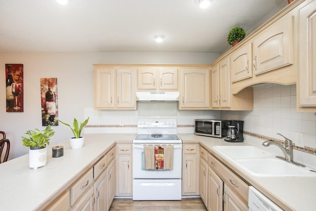 kitchen featuring sink, light brown cabinets, light wood-type flooring, white appliances, and decorative backsplash