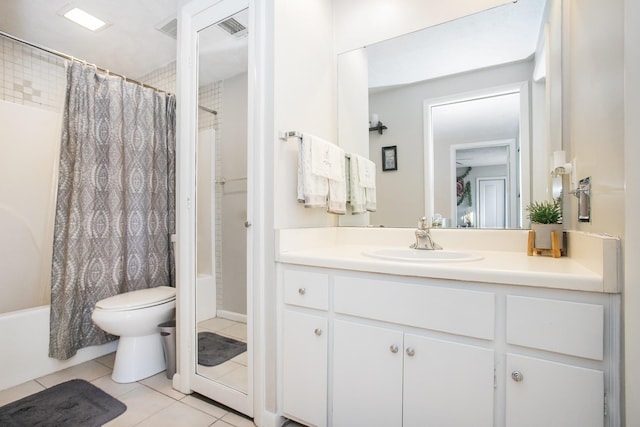 full bathroom featuring shower / tub combo with curtain, tile patterned floors, toilet, and vanity