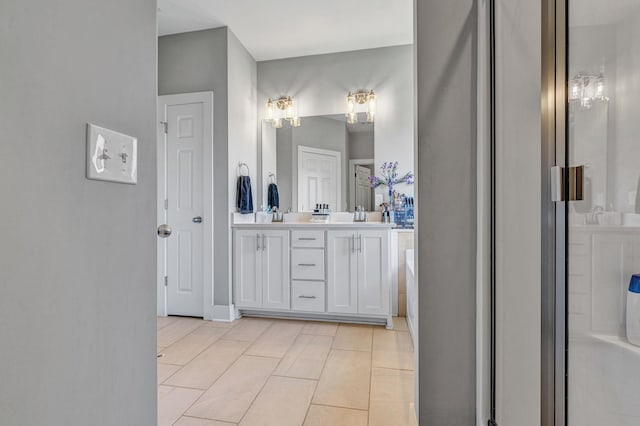 bathroom featuring vanity and a shower with door