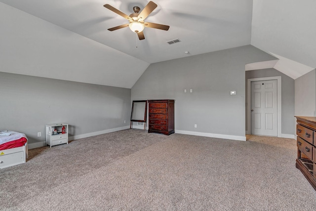 additional living space featuring ceiling fan, light colored carpet, and lofted ceiling